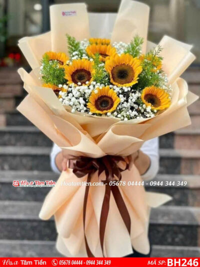 bó hoa 9 bông hướng dương mix cùng giấy cam nhạt