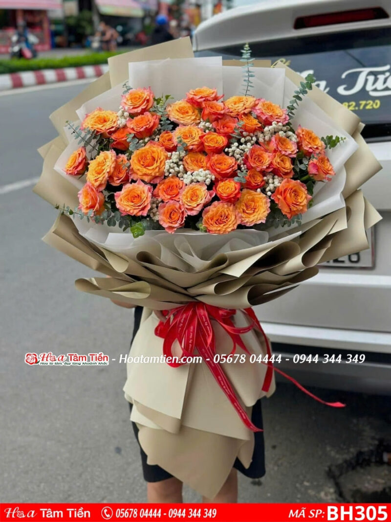 Bó hoa hồng cam mix baby lá bạc gói giấy nâu khổng lồ